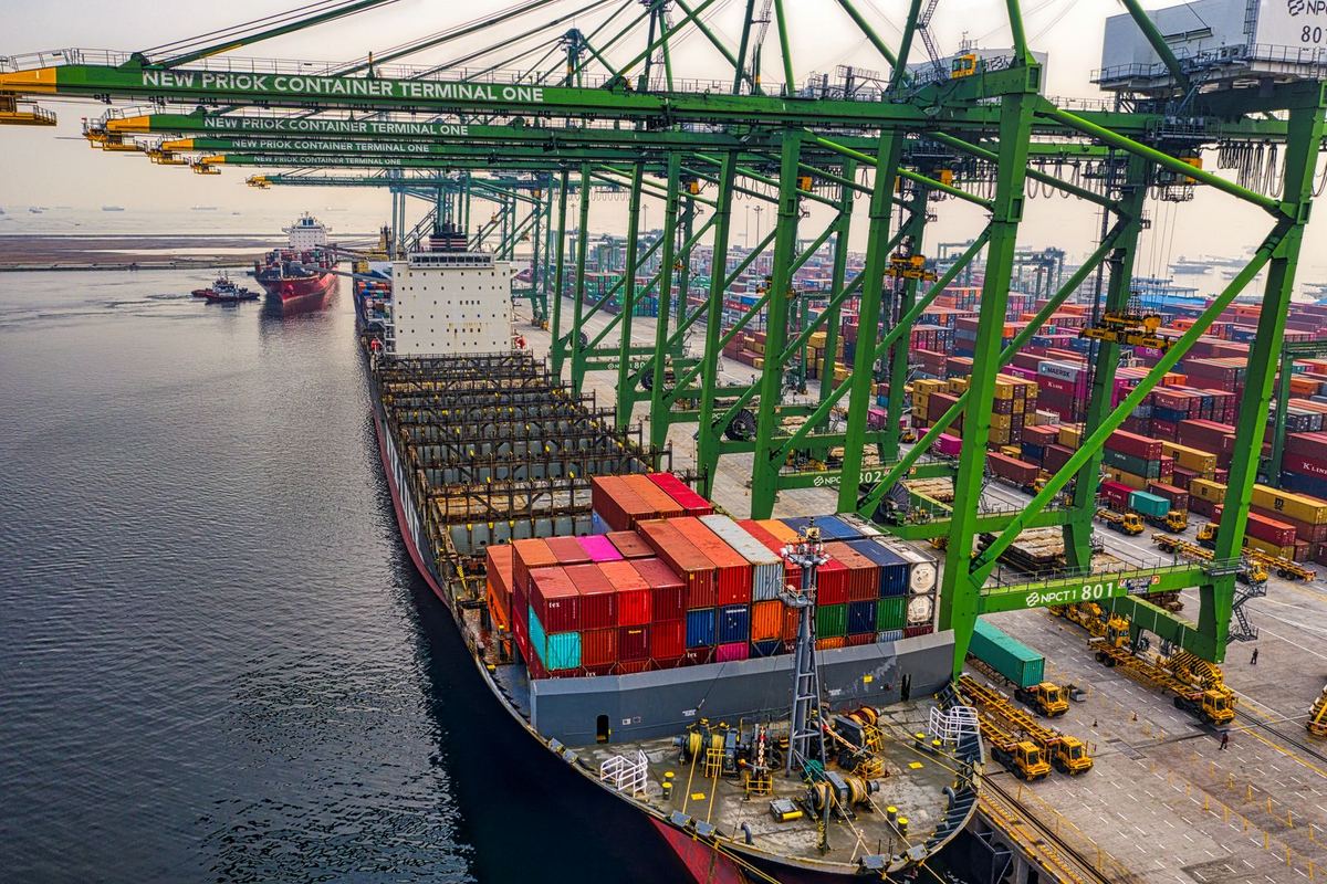 Container ship loading at a terminal